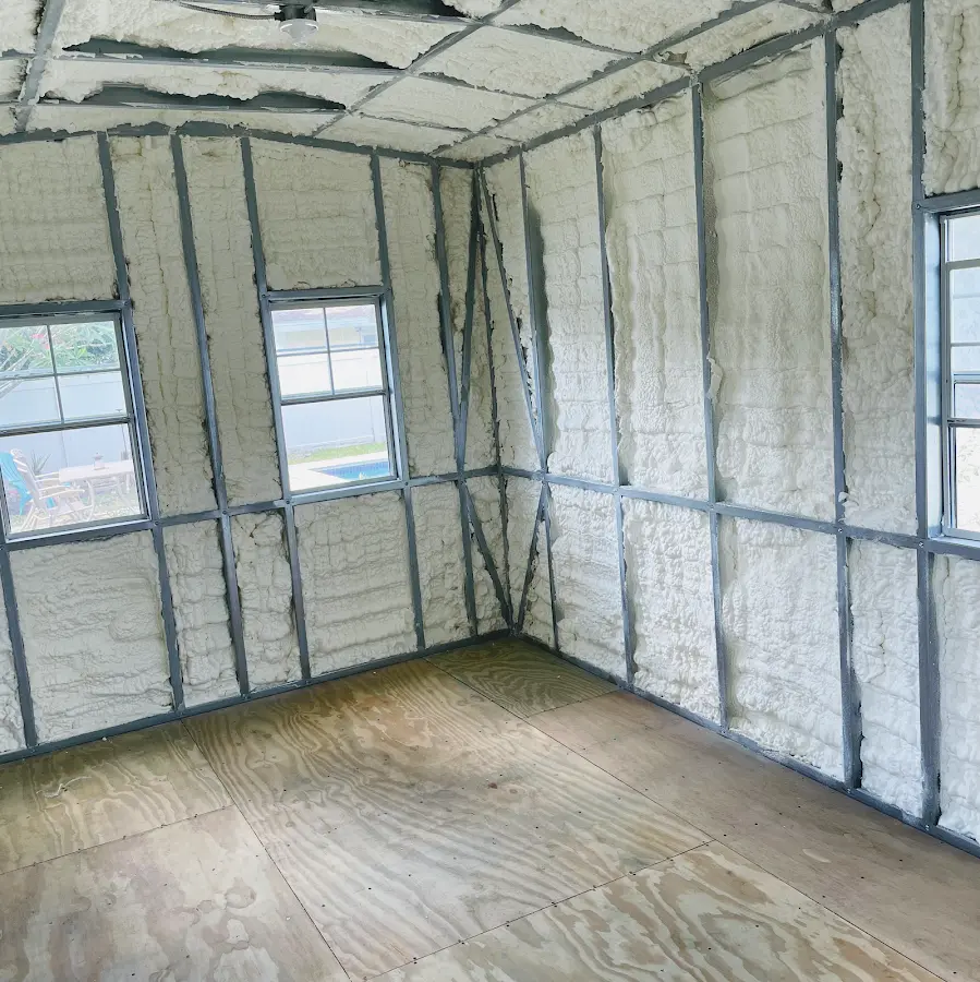 Closed-cell spray foam insulation applied to wall cavities in a residential project in Hopkinton